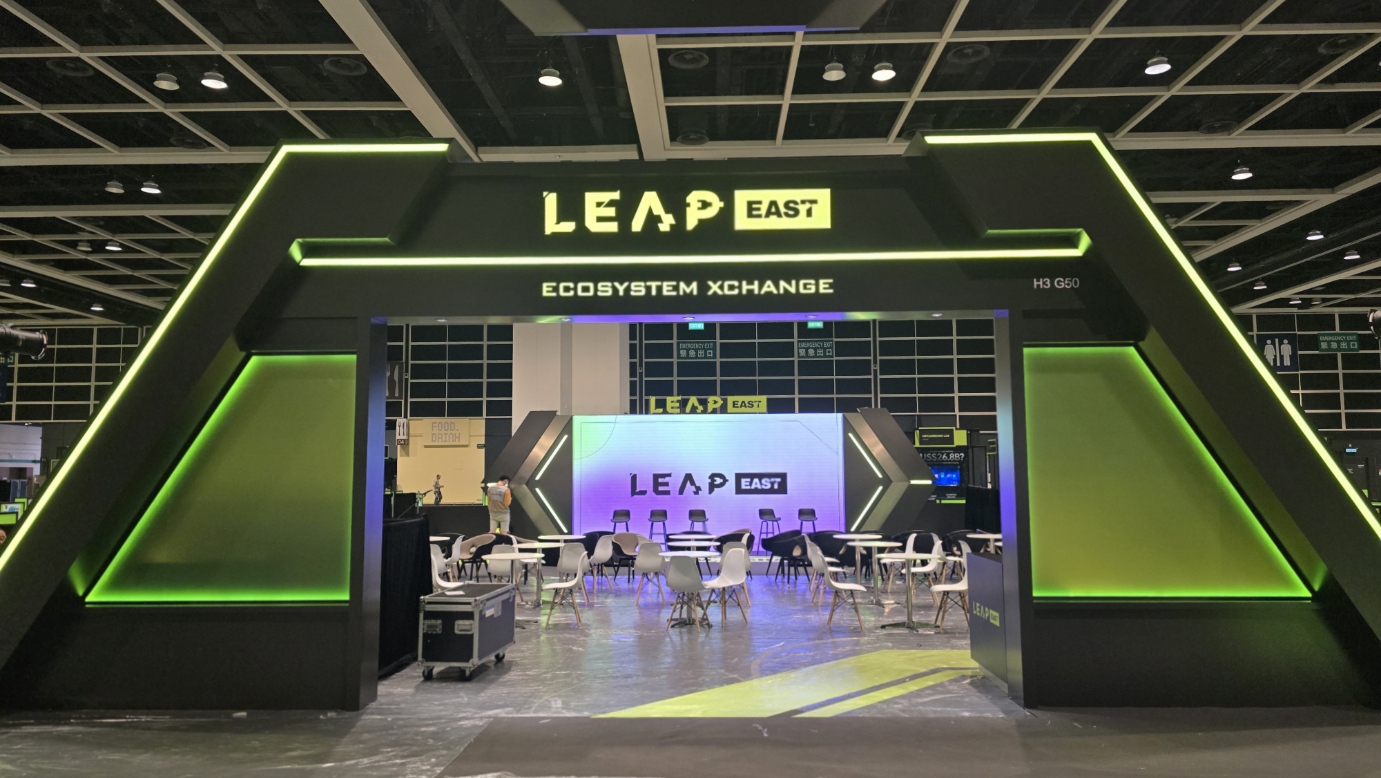 Wider booth view showing ITG Factoring AI within the startup exhibition area.